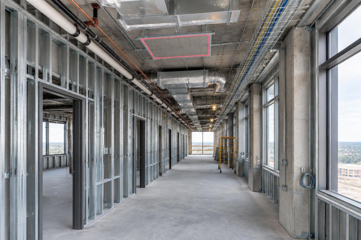 Illustrative unfinished corridor; marker 1 identifies the ceiling area requiring access clarification